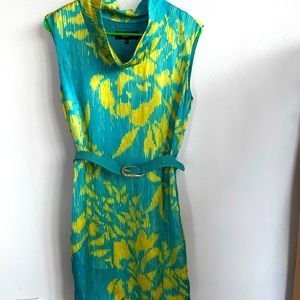 Short dress over the knee with cowl neck . Comes with belt.